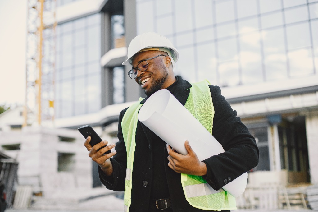 Verified professional engineer reviewing project specifications on a mobile phone